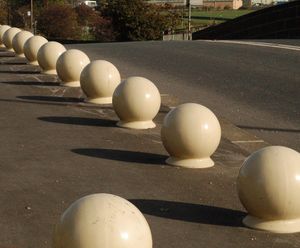 Recycled spherical bollards over The River Aire