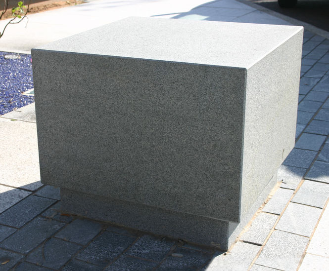 Cubist features granite bollard seat 1000