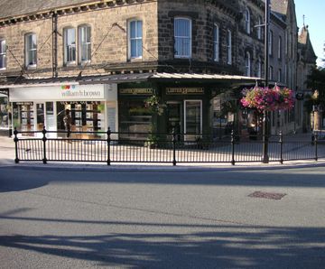Cast iron post and panel with top rail for town centre