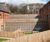 Timber retaining walls with fence extension for housing 1