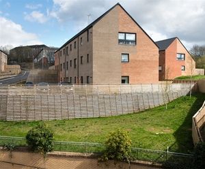 Timber retaining walls with fence extension for housing
