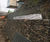 Gabion baskets support existing stone wall at university 0