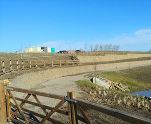 Two-tier gabion wall for housing development SuDS pond