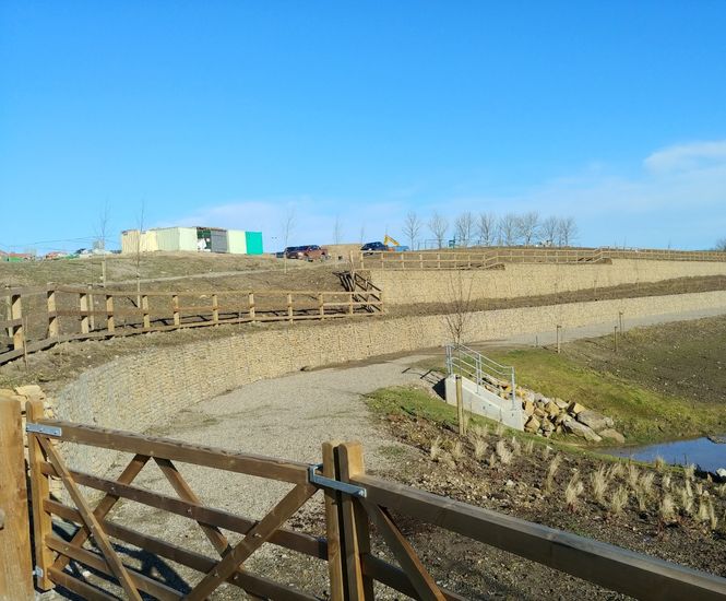 Two-tier gabion wall for housing development SuDS pond