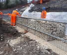 Gabion retaining walls stabilise railway embankment