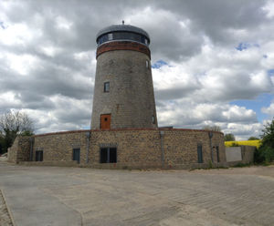 Living green roof for historic windmill home