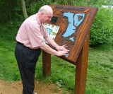 Tactile sand-blasted timber signs with graphics - on this page