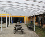 Freestanding tiered shelter covers school courtyard - on this page