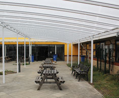 Freestanding tiered shelter covers school courtyard