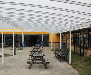 Freestanding tiered shelter covers school courtyard