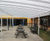 Freestanding tiered shelter covers school courtyard 0
