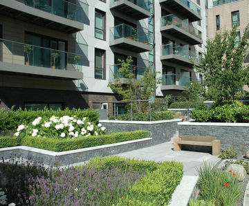 Hardwood seats and planters for green landscaping scheme