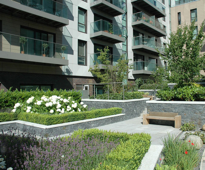 Hardwood seats and planters for green landscaping scheme