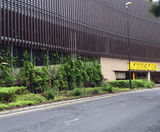 Bronze cladding and mesh fencing - supermarket car park - on this page