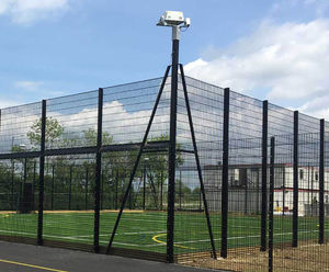 Integrated floodlight posts for sports fencing