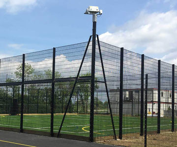 Integrated floodlight posts for sports fencing