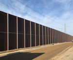 Acoustic barrier posts for roads and railway lines