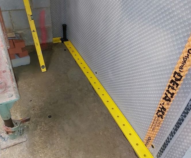 Remedial basement waterproofing
