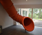 Bespoke indoor tube slide installed in family home