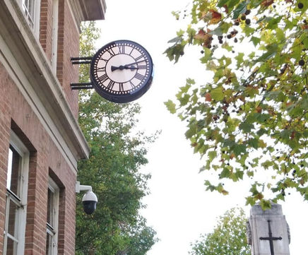 Double-sided exterior drum clock for civic centre