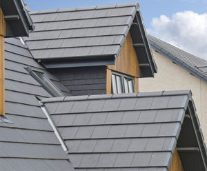 Interlocking concrete roof slates for exposed housing