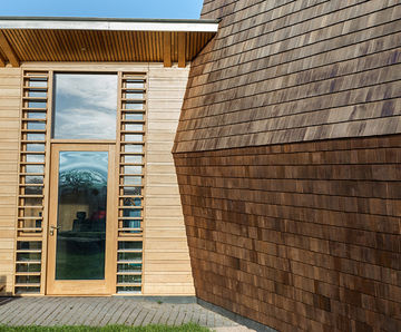 Natural cedar shingles for rural music therapy centre 