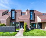Clay roof and wall tiles used for award-winning village - on this page