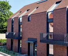 Clay tiles for roof and facade of apartment block - Lithuania