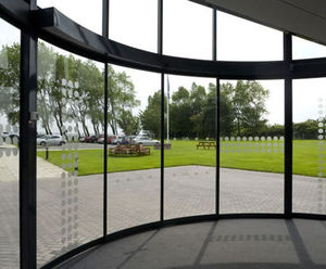 Curved automatic sliding doors