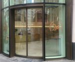 Curved bi-parting glass doors at landmark London offices
