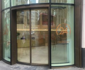 Curved bi-parting glass doors at landmark London offices