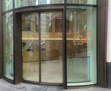 Curved bi-parting glass doors at landmark London offices