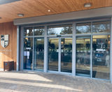 Bi-parting automatic sliding entrance doors - golf club - on this page