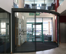 Quiet automatic door system for university library