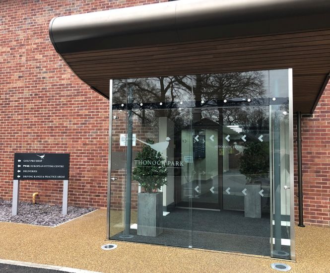Automatic entrance doors and glass storm lobby