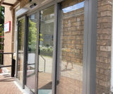 IP65-rated automatic sliding external door at university - on this page