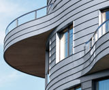 RHEINZINK zinc cladding creates curved facade - on this page