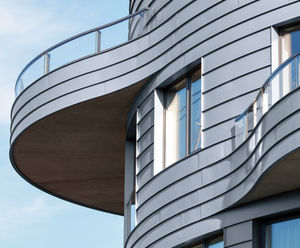 RHEINZINK zinc cladding creates curved facade