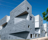 Zinc Angled Standing Seam clads geometric building - on this page