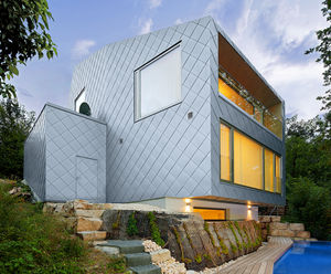 Zinc square tile cladding gives home diamond effect