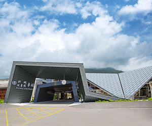 Zinc tiles and seamed cladding for railway station