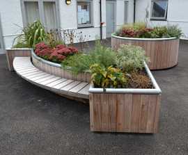 Planters with integrated seating