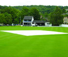 Lay-flat rain covers for cricket pitch protection
