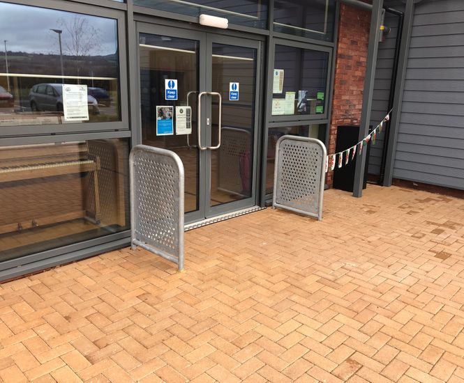 Sheffield - perforated steel entrance door barrier