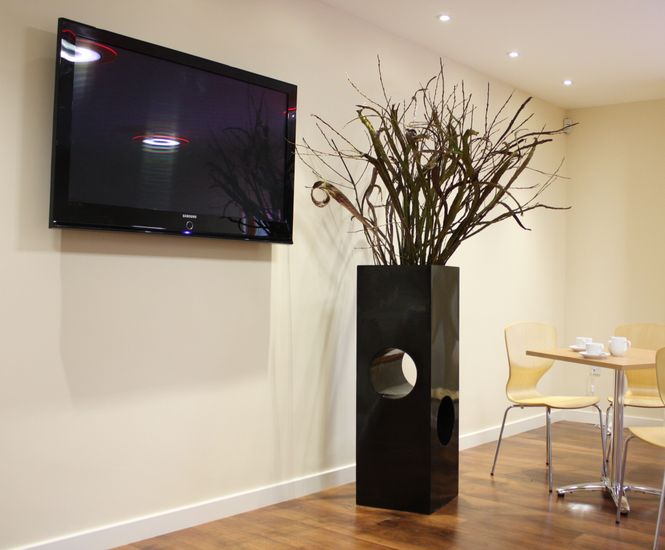 Tower Geo Design - tall fiberglass planter for modern outdoor spaces