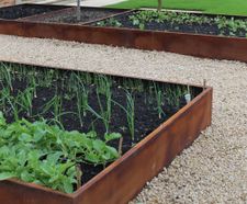 Corten steel finish planters for award-winning garden
