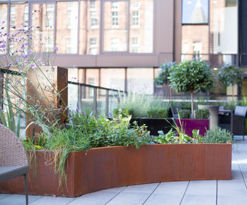 Bespoke faux corten steel planters for balcony