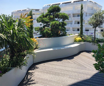 Curved planters and seating for Parisian roof garden