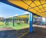 Covered walkway canopy links primary school classrooms