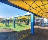 Covered walkway canopy links primary school classrooms - on this page